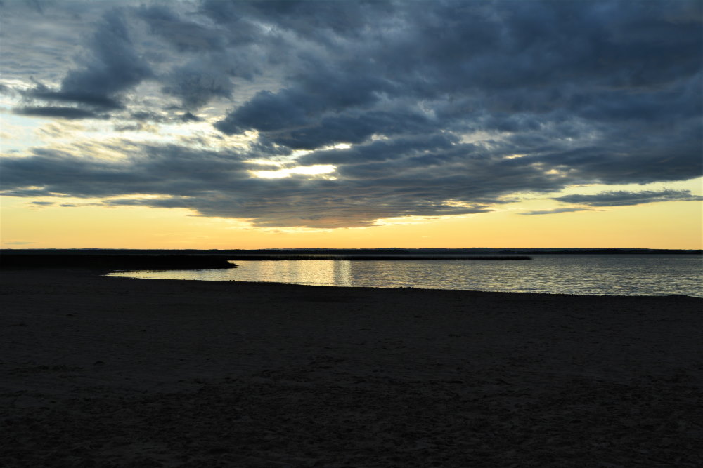 dusk starting looking over beach and lake in alberta canada