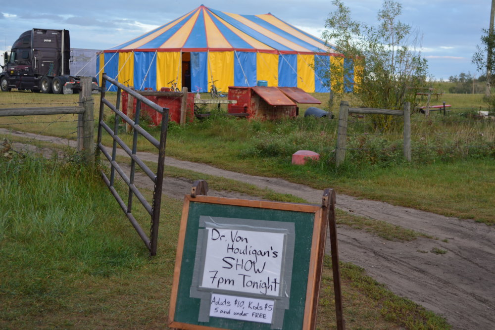 blue and yellow circus tent in field