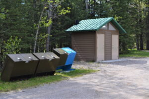 Pit toilets and bear-proof garbage containers