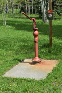 Red, rusted handpump for drinking water