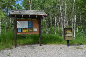 campground registration kiosk next to message board