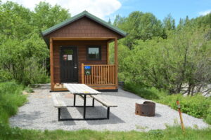 wooden hut for warming up with wood stove and benches